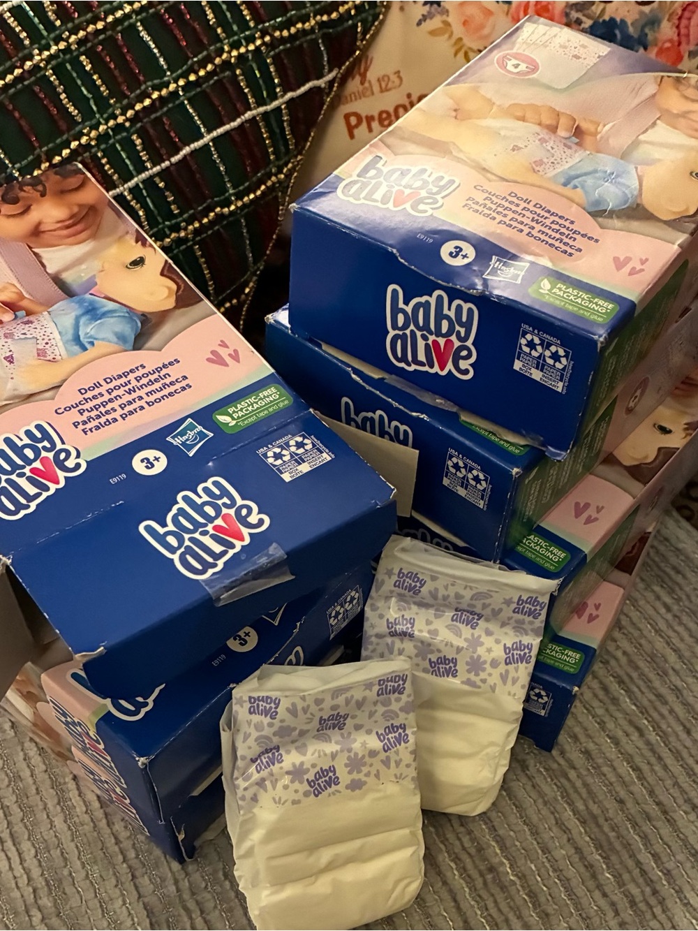 New inbox bundle of seven boxes of baby alive diapers, total of 28 diapers